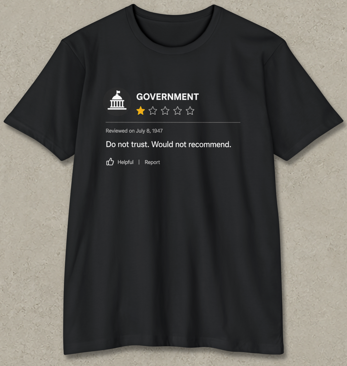 A black short-sleeve t-shirt with a white graphic print resembling a review rating for 'GOVERNMENT', featuring a star rating of 1 out of 4 and the text 'Do not trust. Would not recommend.