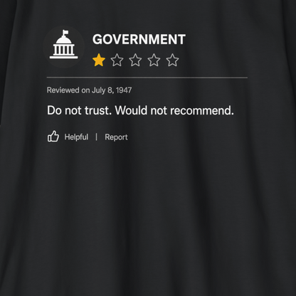 A close-up of a black garment featuring a printed graphic styled like a Reddit review for 'GOVERNMENT' with a one-star rating and the text 'Do not trust. Would not recommend.