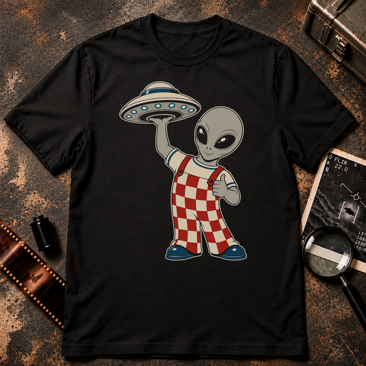 Retro grey alien wearing red-and-cream checkered overalls, giving a thumbs-up while holding a small flying saucer above one hand.