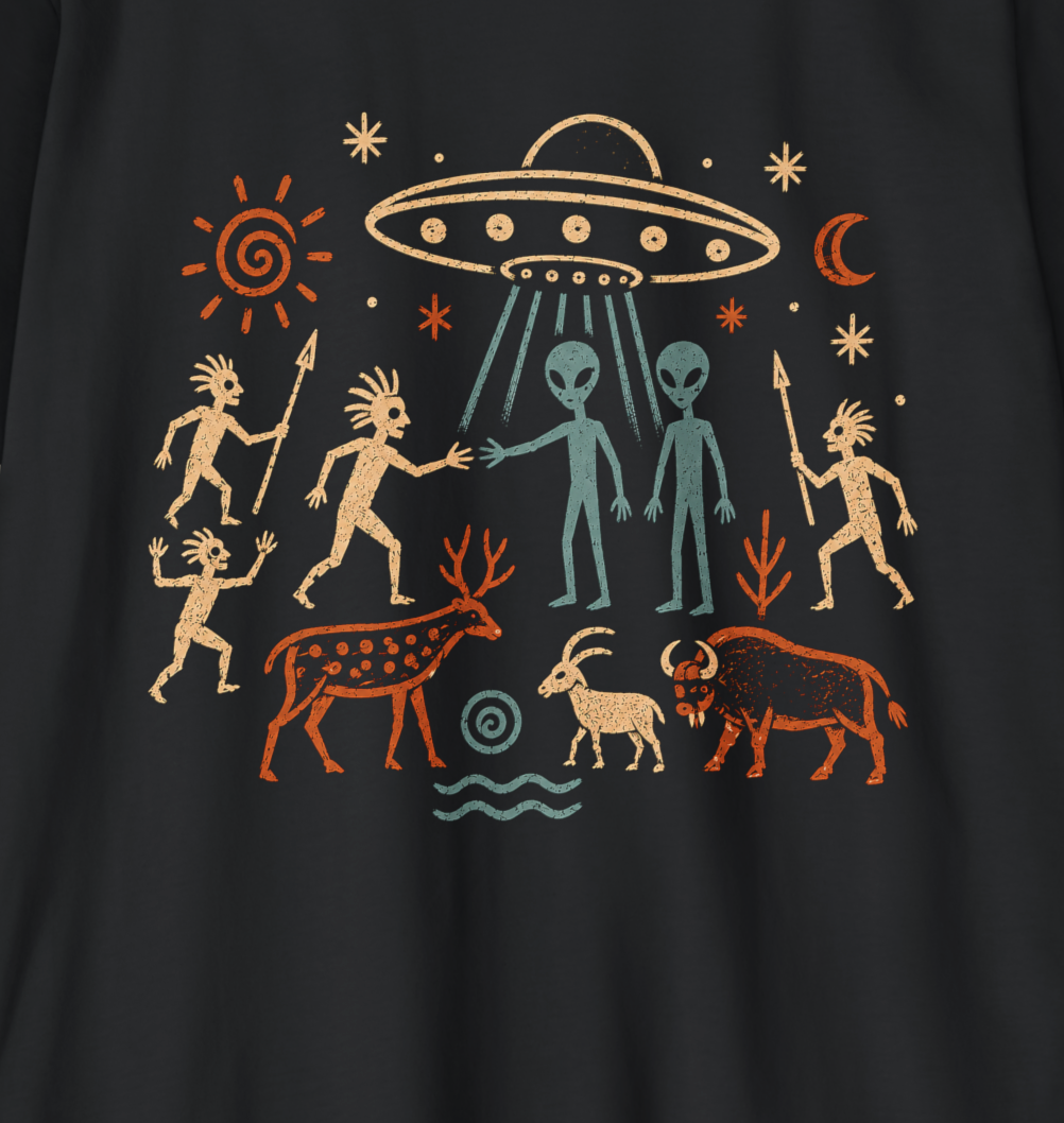 A black short-sleeve crewneck t-shirt with a colorful graphic print on the front, featuring a pre-Columbian style illustration of a UFO, aliens, humans, animals, and celestial bodies, displayed flat against a textured gray background.