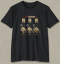 A black short-sleeve crewneck t-shirt with a graphic print of three pigeons charging at wall outlets, displayed flat against a textured gray background.