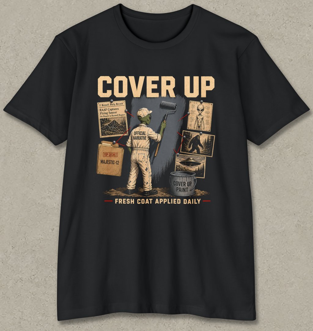 A black short-sleeve crewneck t-shirt with a vintage-style graphic on the front. The graphic features a construction worker painting a wall next to a paint can, with the text 'COVER UP' at the top and 'FRESH COAT APPLIED DAILY' at the bottom.