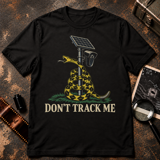 Don't Track Me shirt graphic with a yellow rattlesnake coiled around a solar-powered surveillance camera pole