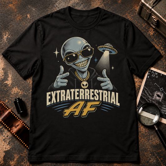 Extraterrestrial Shirt design featuring a smiling grey alien with jeweled grill, sunglasses, gold chain, finger guns and a hovering UFO.