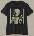 A black short-sleeve crewneck t-shirt featuring a graphic print of a classic alien pointing forward, set against a textured gray background.