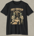 A black short-sleeve crewneck t-shirt with a vintage-style graphic print on the front. The graphic features the text 'FREE CHECKUP' in a distressed beige font above an illustration of a man in a hospital gown surrounded by two green-skinned aliens under a surgical light.