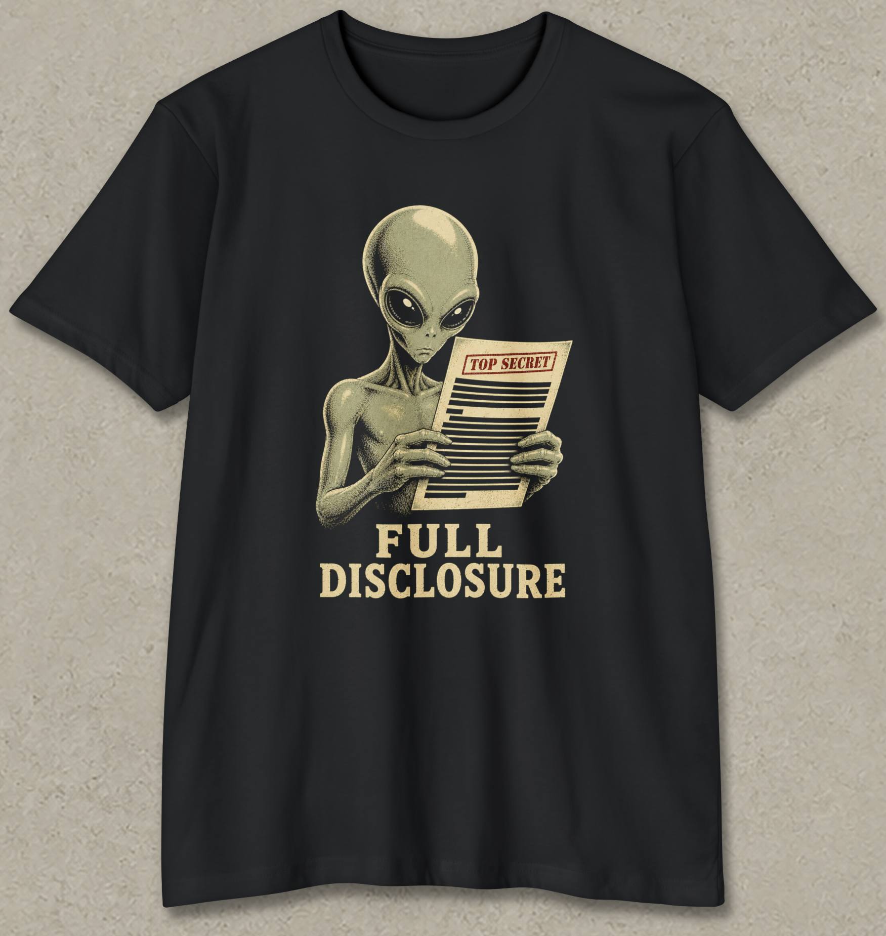 A black short-sleeve crewneck t-shirt featuring a retro-style graphic of a gray alien holding a 'TOP SECRET' document with the text 'FULL DISCLOSURE' printed below in beige.