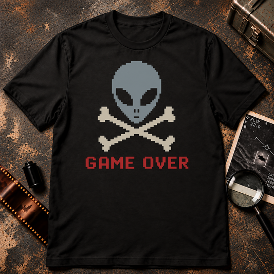 Retro pixel art alien skull and crossbones design with a blue-grey alien head, cream crossed bones, and red GAME OVER text on a black background.