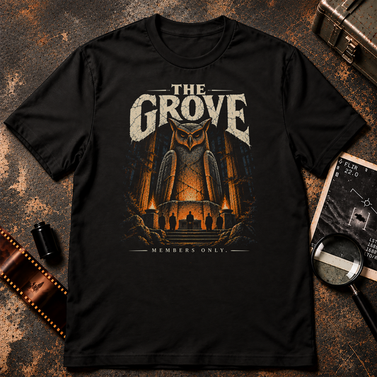 The Grove T-Shirt graphic featuring a massive illuminated owl statue towering over five shadowy figures in suits gathered around an altar in a dark forest. Orange torchlight illuminates the scene beneath distressed cream lettering reading THE GROVE and MEMBERS ONLY.