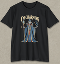 A black short-sleeve crewneck t-shirt featuring a graphic of a hooded wizard with a skull for a head, holding a staff, with the text 'I'M CHARMING' above. The graphic has blue, gold, and white details, set against a textured gray background.