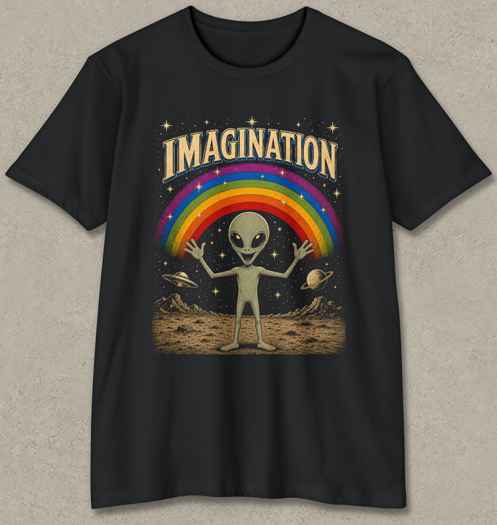 A black short-sleeve t-shirt with a retro-style graphic on the front. The graphic features the word 'IMAGINATION' in a gold-colored arched font above a classic rainbow, a light green alien standing on a dusty surface, and small planets in a starry black sky.