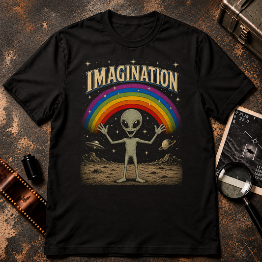 Retro sci-fi alien standing beneath a colorful cosmic rainbow with arms raised, surrounded by stars, planets, and a UFO under the word IMAGINATION.