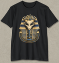 A black short-sleeve crewneck t-shirt featuring a graphic of an alien styled like Pharaoh with a gold and blue striped headdress, displayed against a textured gray background.