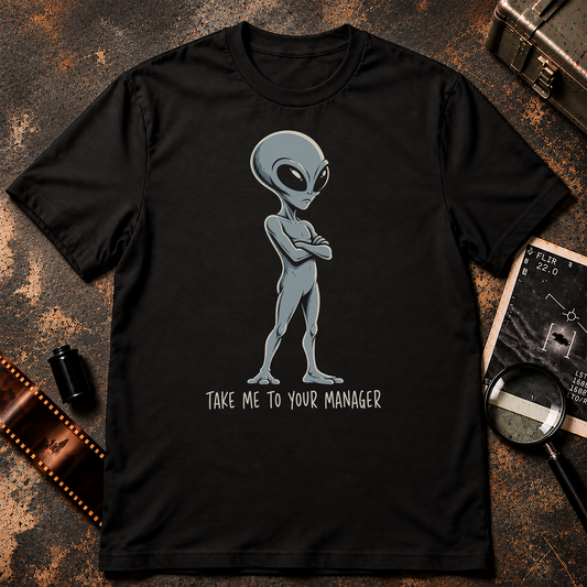 Grey alien standing with arms crossed above the words “Take Me to Your Manager” in a humorous Official Narrative UFO t-shirt design.