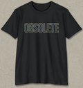 A black short-sleeve crewneck t-shirt with the word 'OBSOLETE' printed across the chest in a retro, outlined font. The letters are filled with a camouflage pattern in shades of green, blue, and brown.