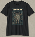 A black short-sleeve crewneck t-shirt with a graphic print on the front. The graphic features the text 'INHUMAN CREATION STATION' in beige and teal above a stylized human figure made of circuit board lines.