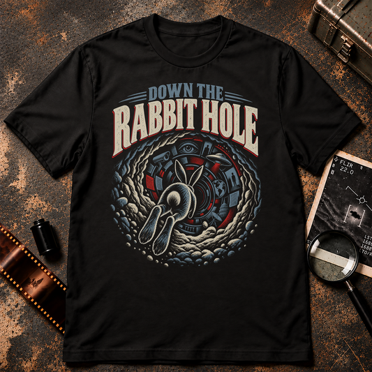 Down the Rabbit Hole conspiracy shirt graphic with a rabbit entering a tunnel filled with UFO, surveillance and government imagery