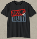 A black short-sleeve t-shirt with a graphic print reading 'CONSPIRACY REALITY' on the chest. The top stamp is red with a curled-down bottom corner revealing a white underside, and the bottom stamp is blue-gray.