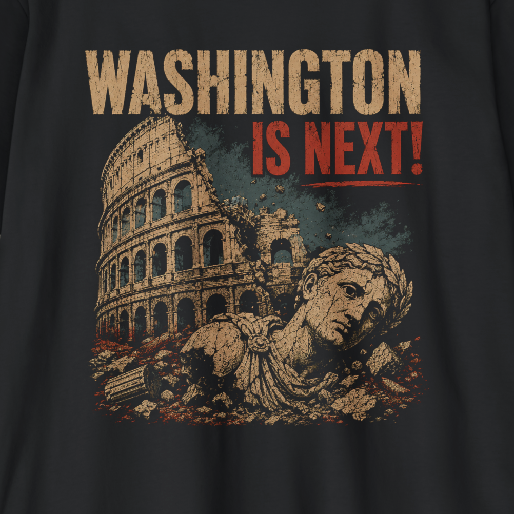 A close-up of a dark charcoal gray t-shirt featuring a distressed graphic print. The graphic displays the Colosseum in Rome with a Roman statue in the foreground, overlaid with the text 'WASHINGTON IS NEXT!' in beige and red lettering.