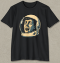 A black short-sleeve crewneck t-shirt featuring a retro-style graphic of a man's screaming face inside a beige astronaut helmet, displayed flat against a textured gray background.