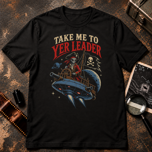 Grey alien dressed as a pirate steering a flying saucer pirate ship beneath the words TAKE ME TO YER LEADER, with cannons, moon, planets, and alien pirate flag.