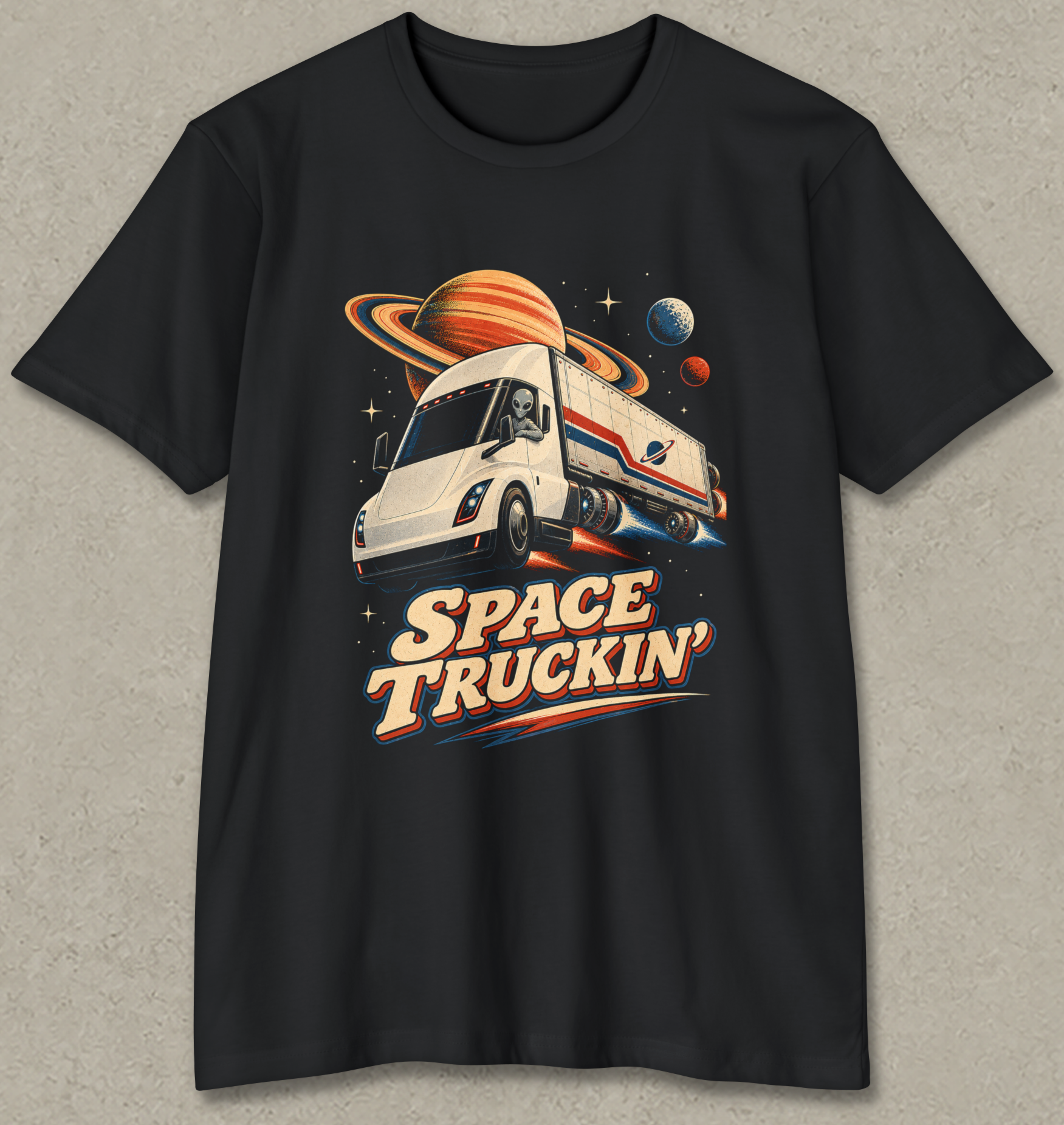 A black short-sleeve crewneck t-shirt featuring a retro-style graphic of a white space truck with planets and stars, and the text 'SPACE TRUCKIN'' in bold retro lettering, displayed against a textured gray background.