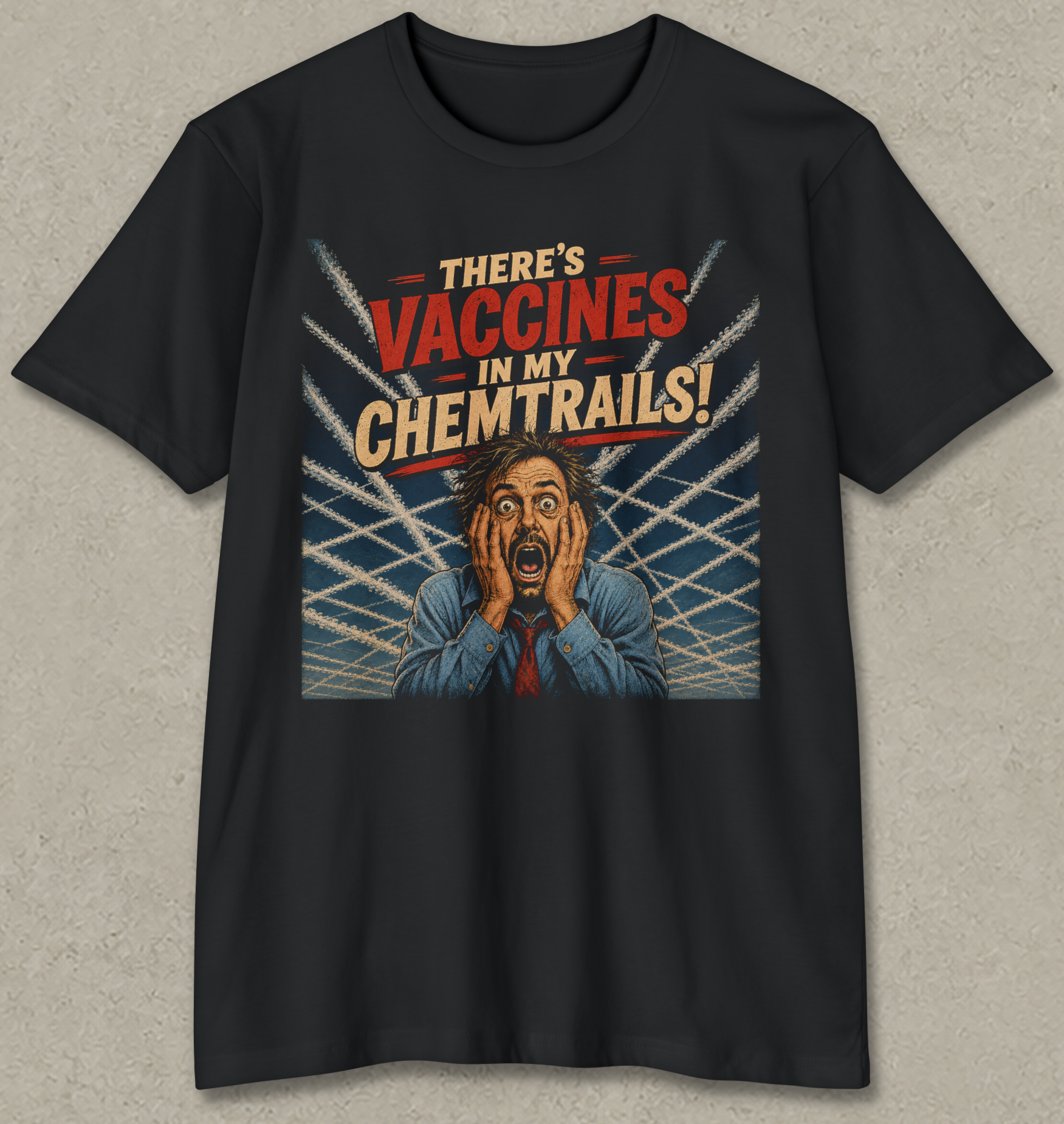 A black short-sleeve crewneck t-shirt with a graphic print on the front. The graphic features the text 'THERE'S VACCINES IN MY CHEMTRAILS!' in red and beige lettering, above an illustration of a shocked man in a blue suit holding his face, set against a background of white airplane trails on a blue sky.