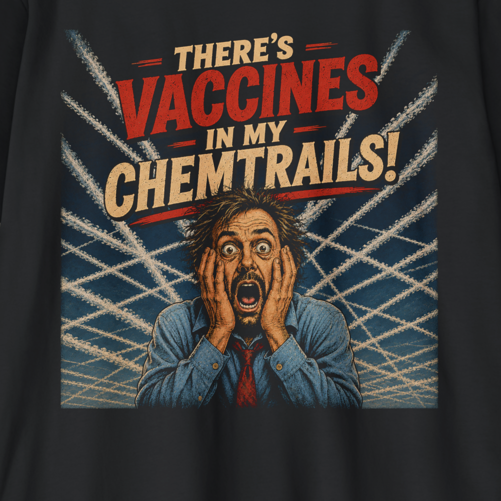 Close-up of a black graphic t-shirt featuring a satirical print with the text 'THERE'S VACCINES IN MY CHEMTRAILS!' and an illustration of a panicked man surrounded by airplane contrails.