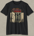 A black short-sleeve crewneck t-shirt with a graphic print on the front. The graphic features a neon sign reading 'WHAT BROOKERS IN VEGAS' above an open wooden door with two tall, thin gray aliens standing inside.