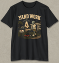 A black short-sleeve crewneck t-shirt with a vintage-style graphic on the front. The graphic features the text 'YARD WORK' in a retro cream font above an illustration of an alien mowing a lawn with a red lawnmower, with a UFO and house in the background.
